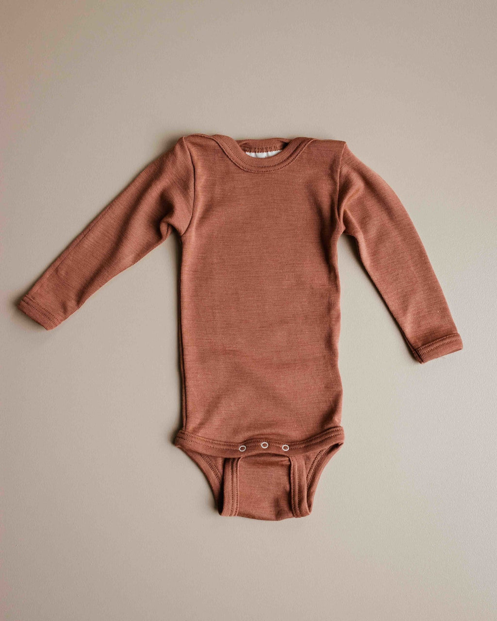 unaduna-sienna-clay-baby-body-long-sleeve-wool-sil